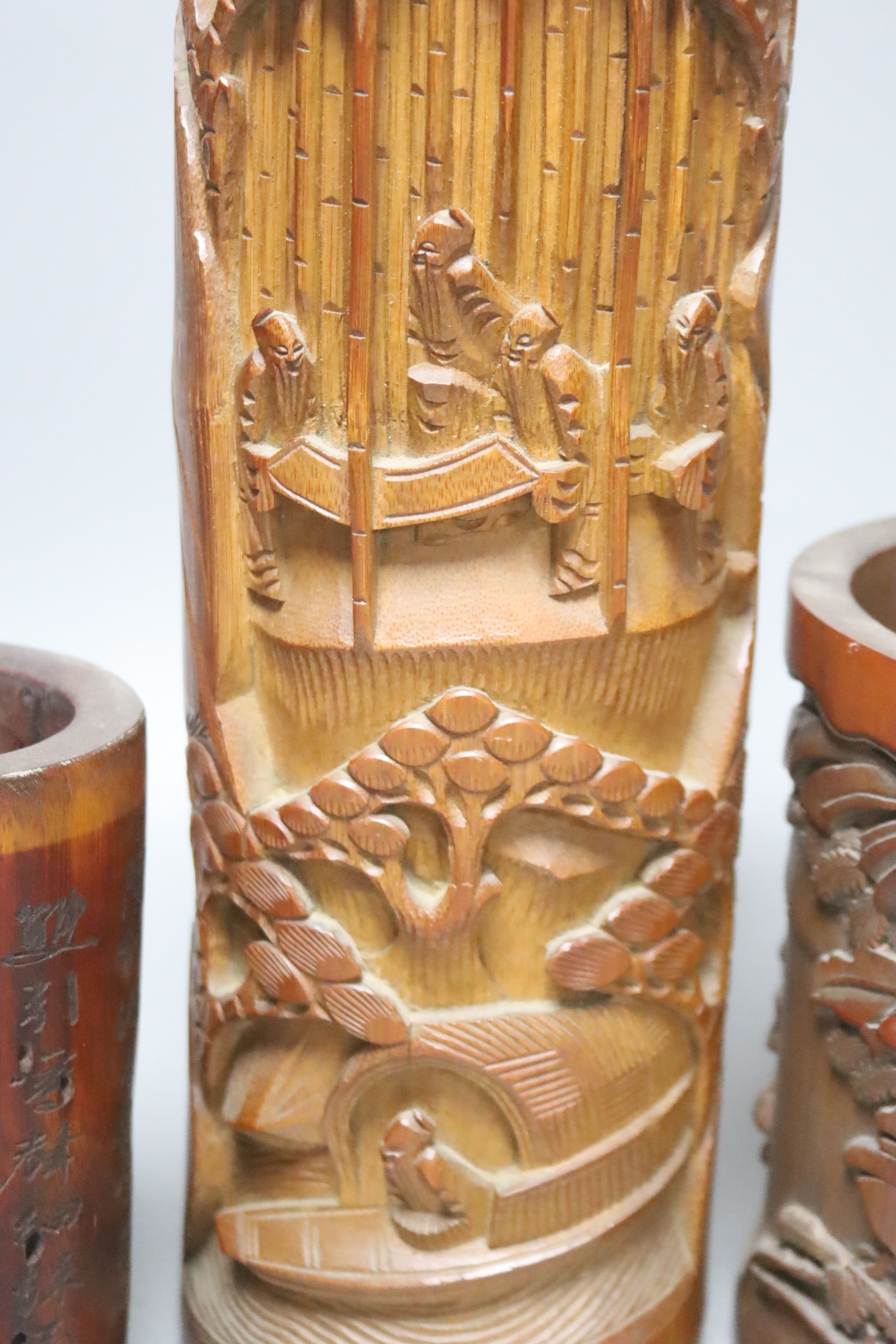 Four Chinese wood and bamboo brush pots, tallest 32cm